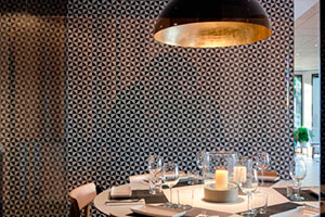 Classic black and white encaustic cement tile with triangle pattern by VIVES